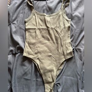 Green bodysuit.